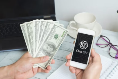 A person holding a fan of hundred-dollar bills in one hand and a smartphone displaying the ChatGPT logo in the other hand, with a laptop, coffee cup, eyeglasses, and a notepad on a desk in the background. Caption: "Earn Money Effortlessly: Discover Lucrative Opportunities with ChatGPT – No Investment Needed!"