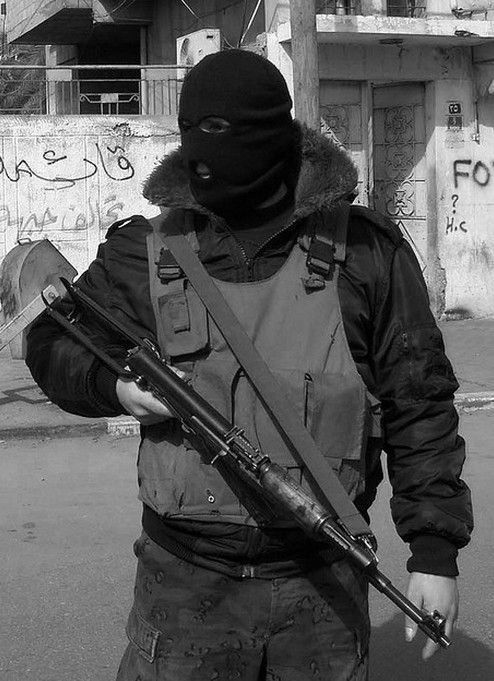 A man wearing a mask grips an AK-47 rifle, representing the violence of the Pahalgam Kashmir terror attack.